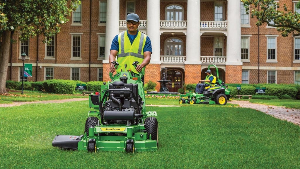 three mowers on grass