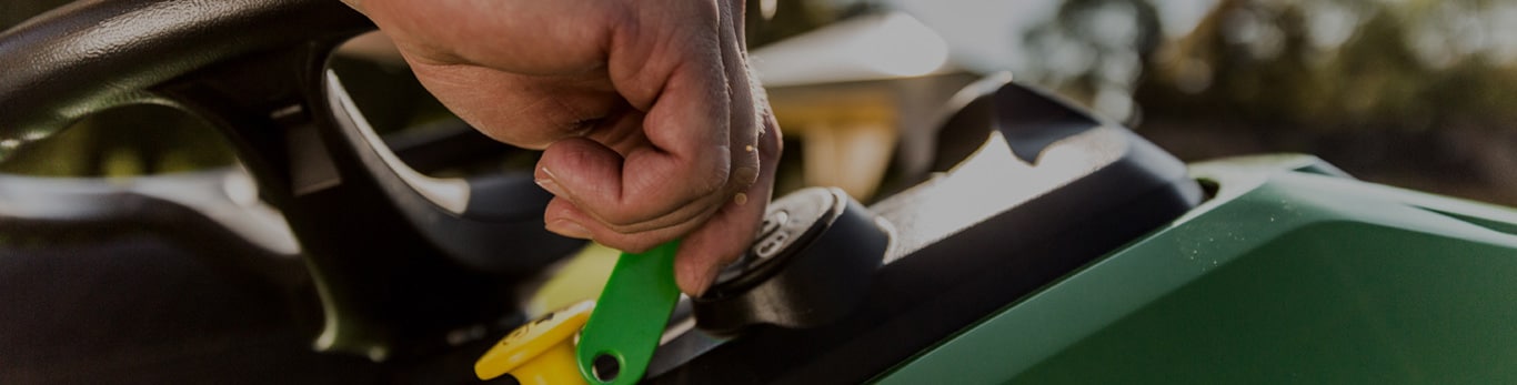 Hand turning a key in an ignition