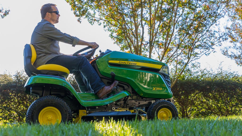 Man mowing grass with an X350 lawn tractor