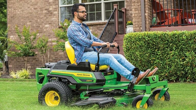 Person riding a Z325E mower