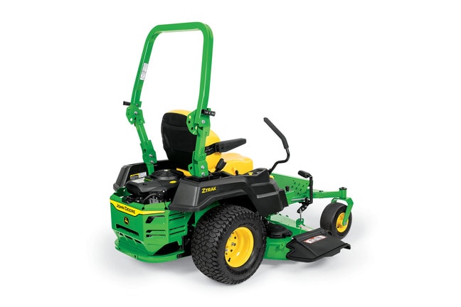 A rear-right-facing studio shot of a green zero-turn mower on a white background.