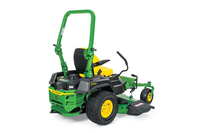 A rear-right-facing studio shot of a green zero-turn mower on a white background.