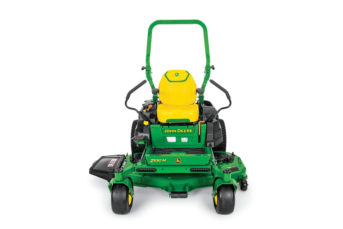 A front-facing studio shot of a green zero-turn mower on a white background.