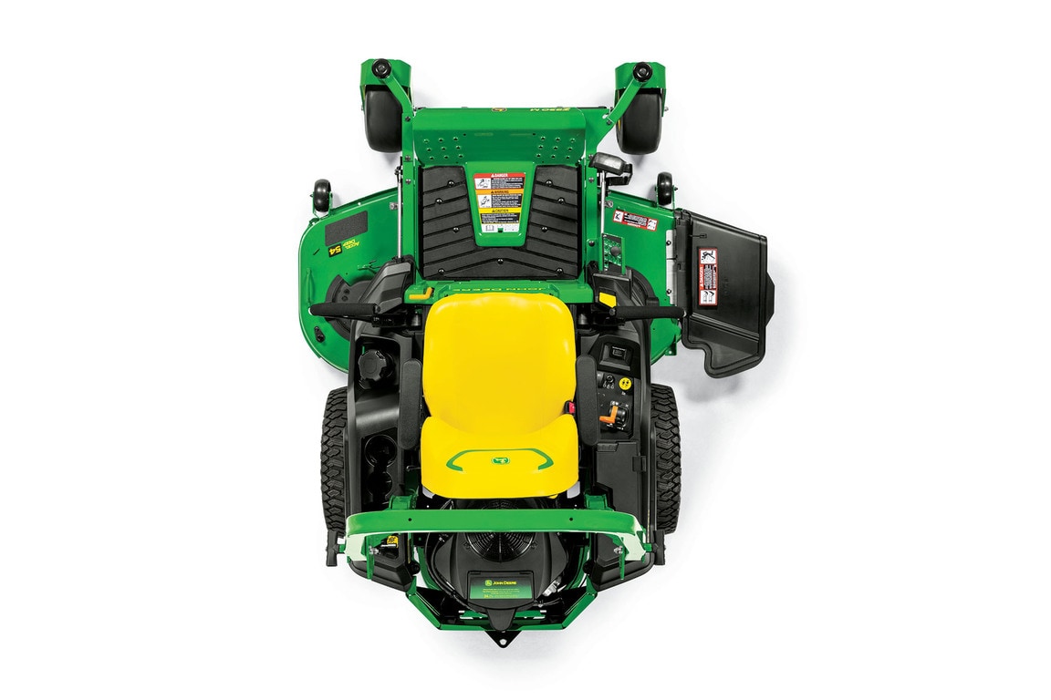 A top-down-facing studio shot of a green zero-turn mower on a white background.