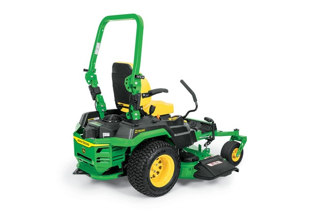 A rear-right-facing studio shot of a green zero-turn mower on a white background.