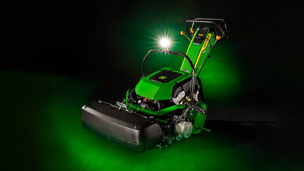 225 E-Cut Electric Walk Greens Mower on a black and green background