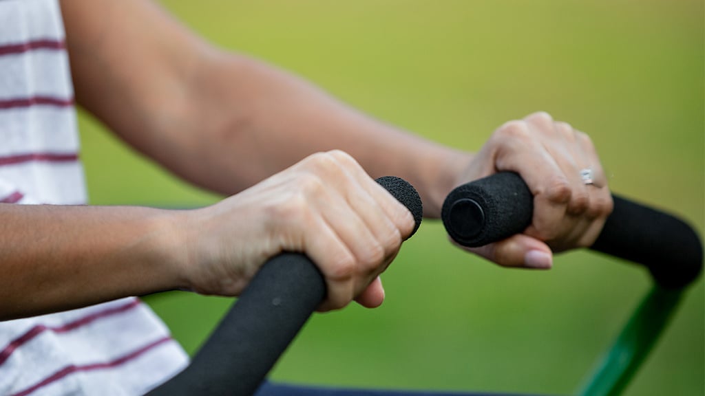 Close up image of hands on the steering