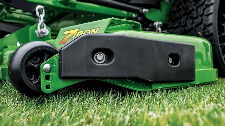 A close-up side shot of a green 7-iron deck for a zero-turn mower.
