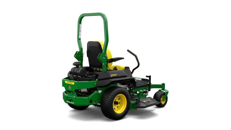 A rear-right-facing studio shot of a green zero-turn mower on a white background.