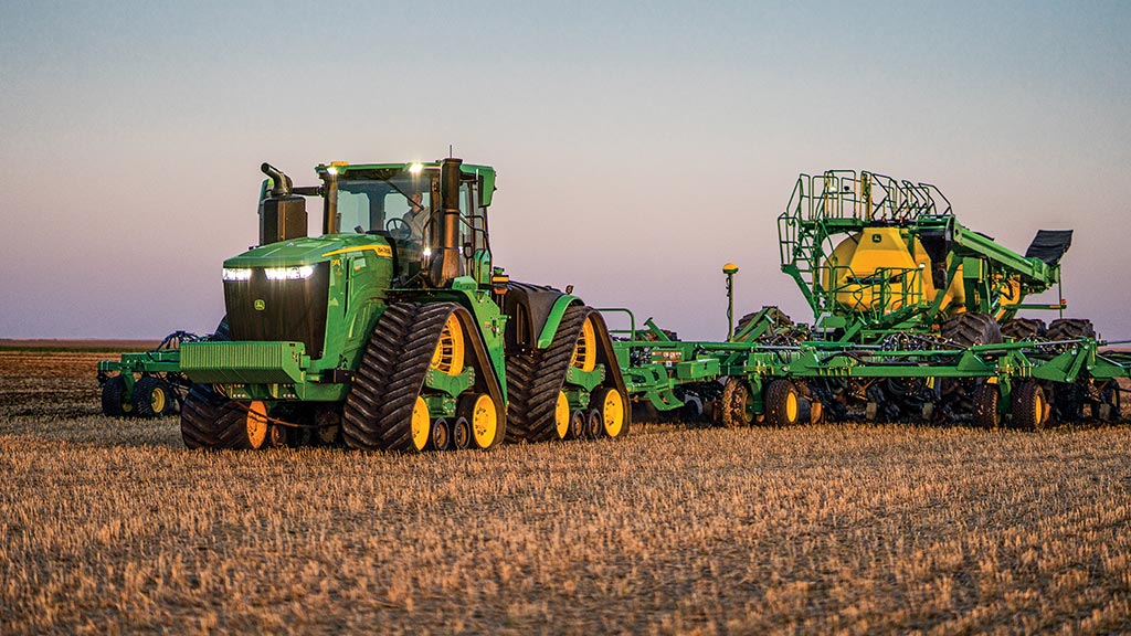 4WD 9 Series Tractor pulling air seeder in field