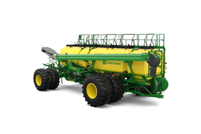 Rear-left-facing studio shot of a green trailing air cart with yellow tanks on a white background.