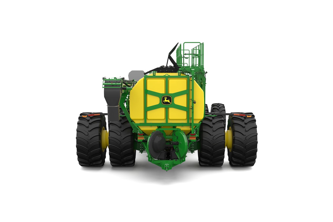 Rear-facing studio shot of a green trailing air cart with yellow tanks on a white background.