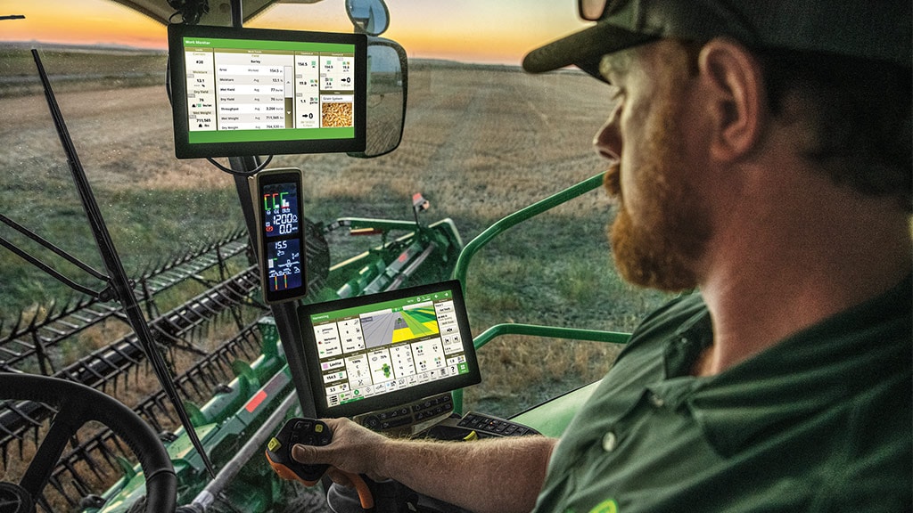 Person in Combine Cab looking at G5 Displays