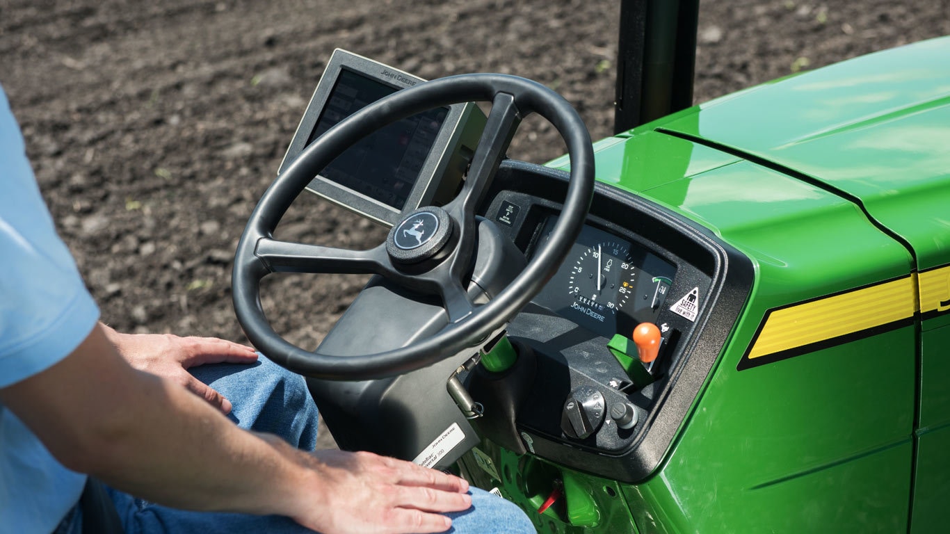 Closeup of steering column in open station tractor