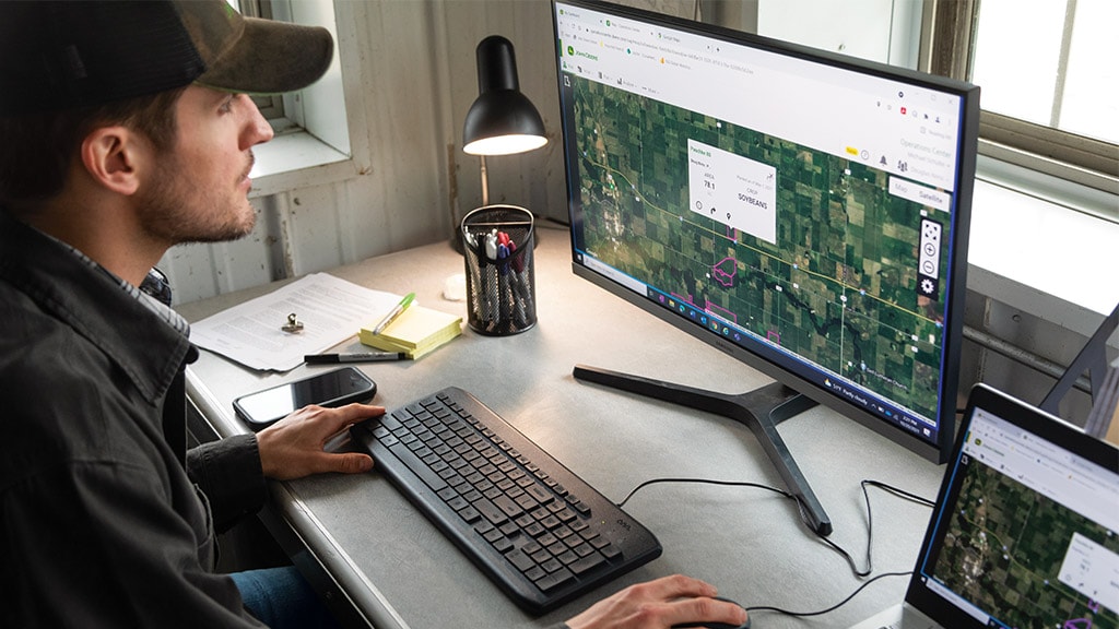 Person sitting at a desk using Operations Center™ on a desktop computer.