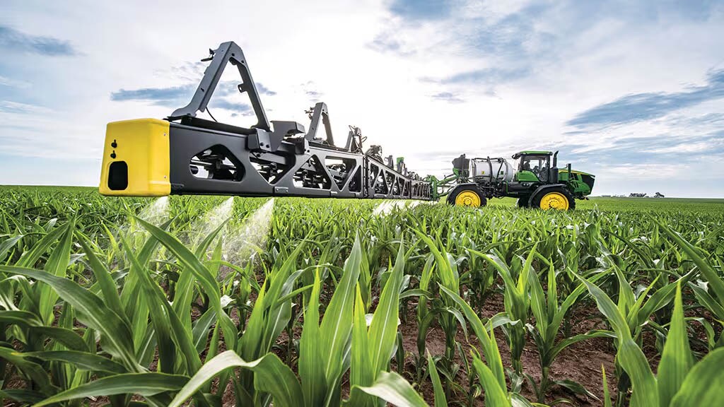 A sprayer in corn field.