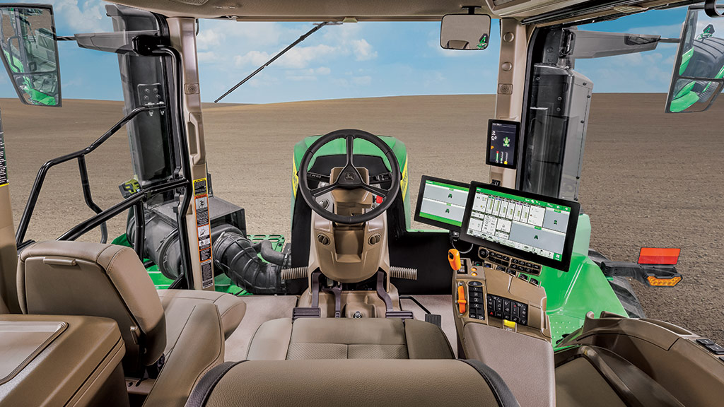 Vue de l’intérieur de la cabine d’un tracteur de la série 9.