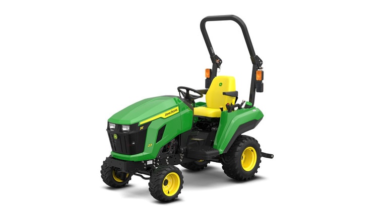 A front-left-facing studio shot of a green compact tractor on a white background.