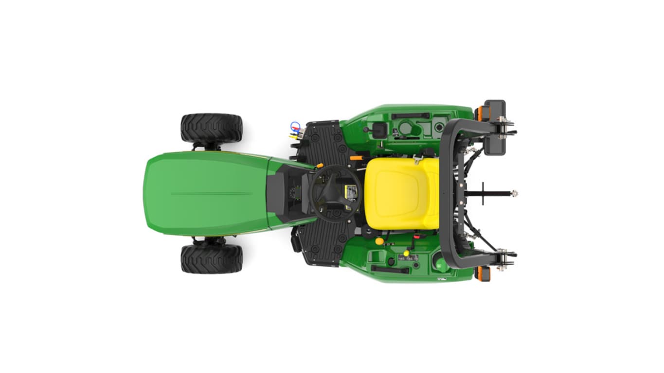 A front-left-facing studio shot of a green compact tractor on a white background.