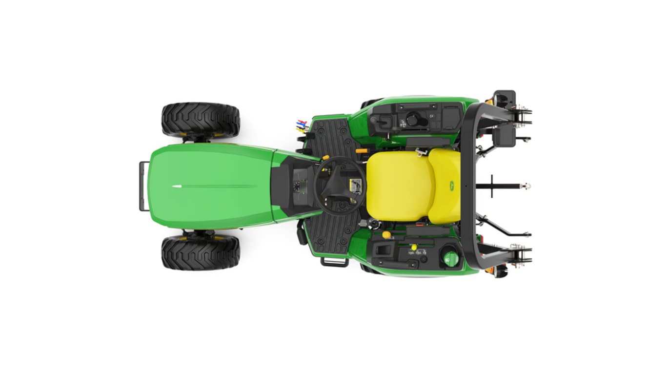 A top-down studio shot of a green compact tractor on a white background.