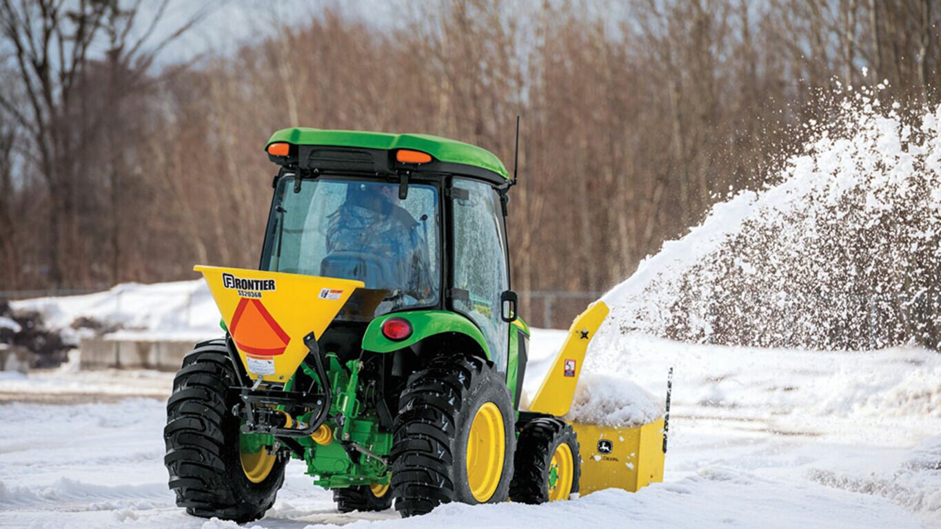 person operating a 3033r removing snow