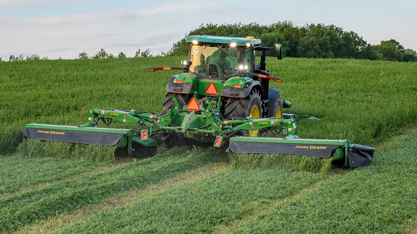 7R tractor cutting grass