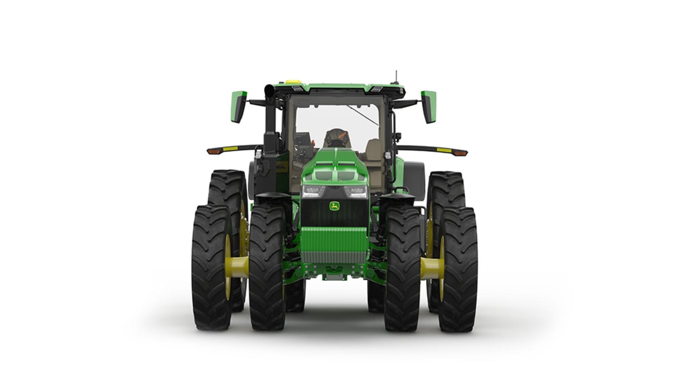 Image studio d'un tracteur vert à 16 roues vu de l'avant sur fond blanc.