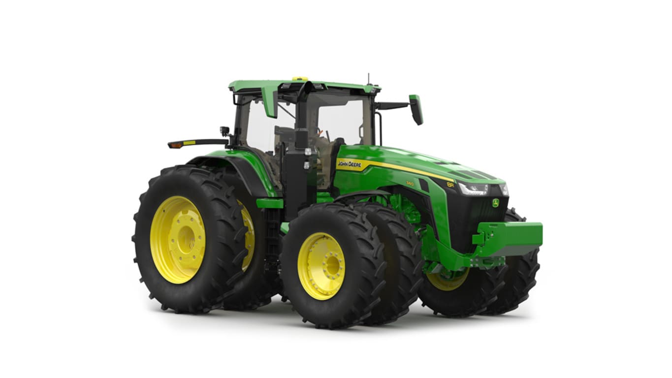 Image studio&nbsp;d'un tracteur vert&nbsp;à 16 roues vu de l'avant droit sur fond blanc.