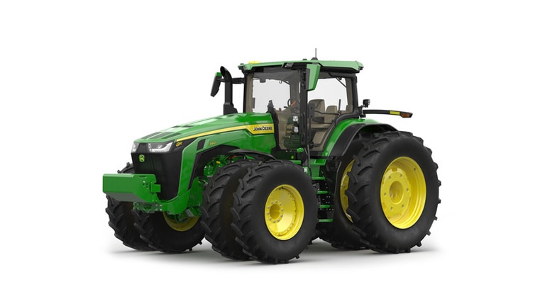 Front-left-facing studio shot of a 16-wheeled green tractor on a white background.