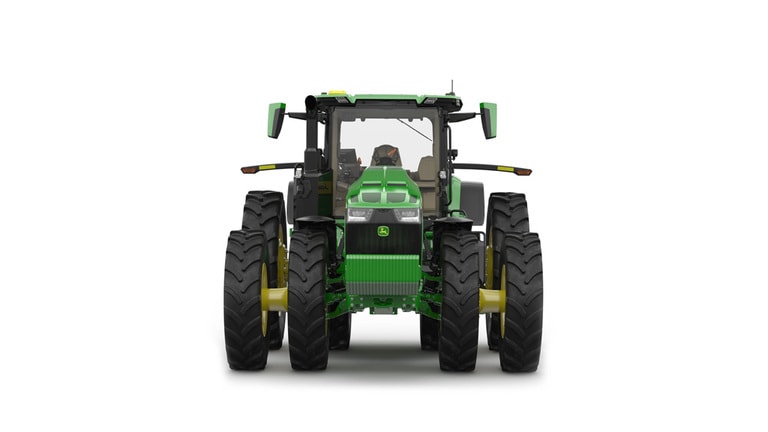 Front-facing studio shot of a 16-wheeled green tractor on a white background.