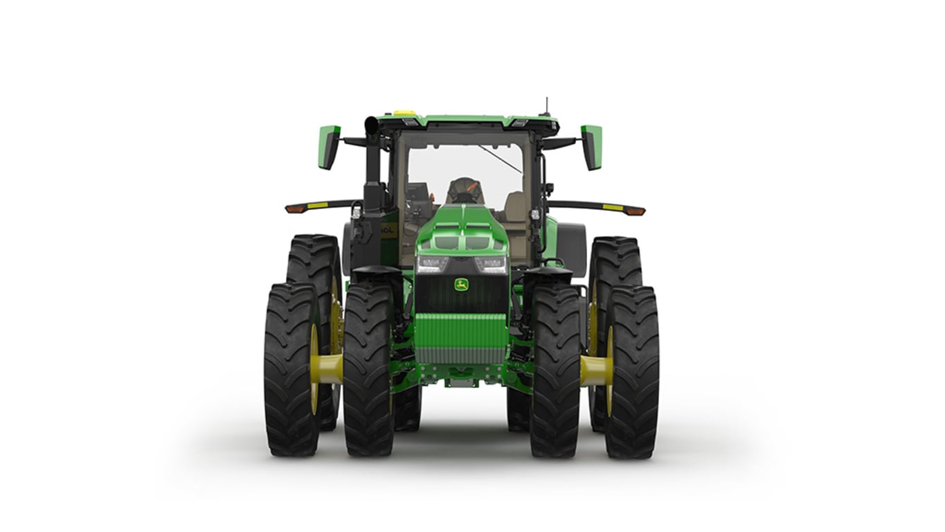 Image studio d'un tracteur vert à&nbsp;16 roues vu de l'avant sur fond blanc.