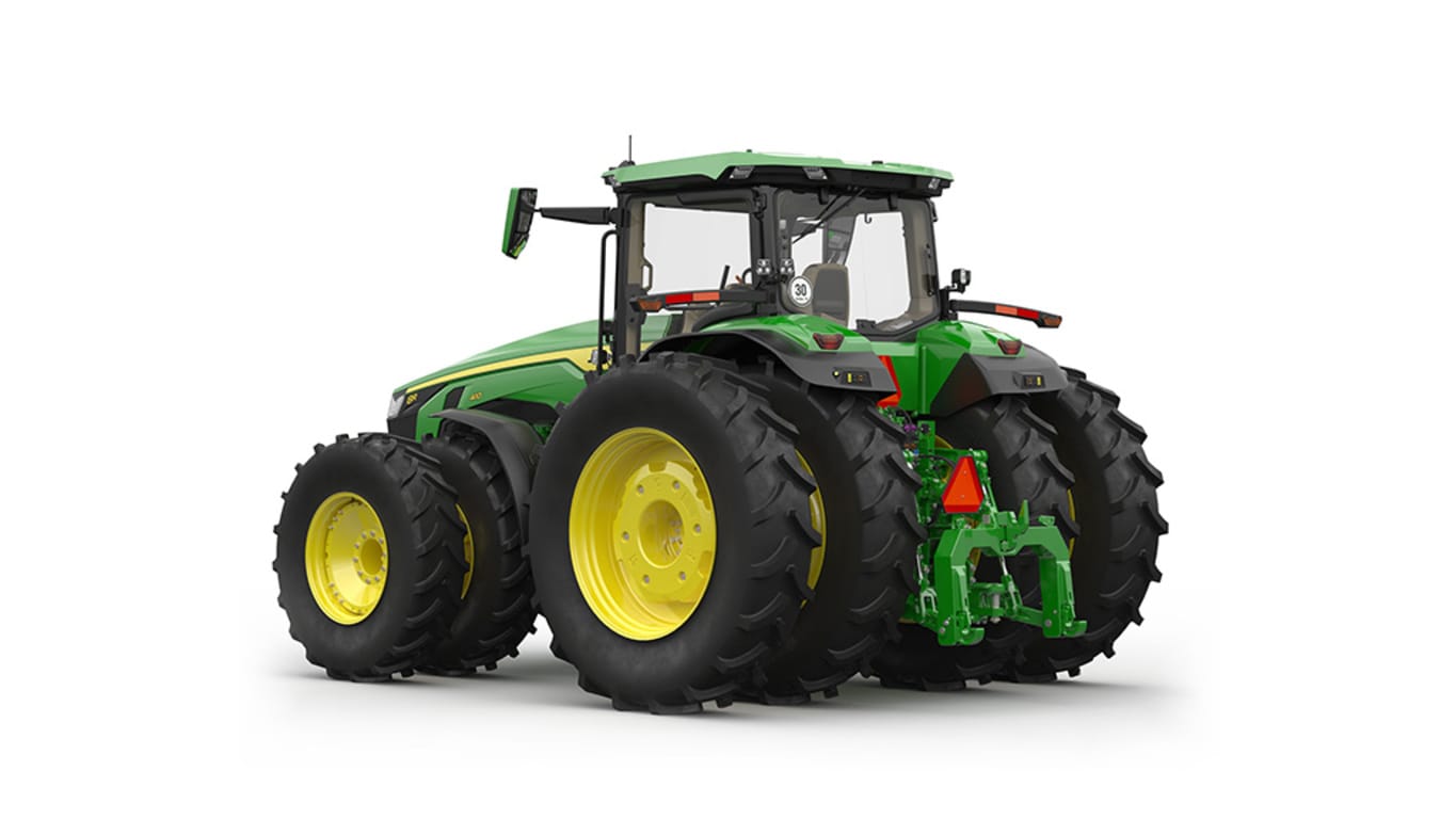 Image studio d'un tracteur vert à&nbsp;16 roues vu de l'arrière gauche sur fond blanc.