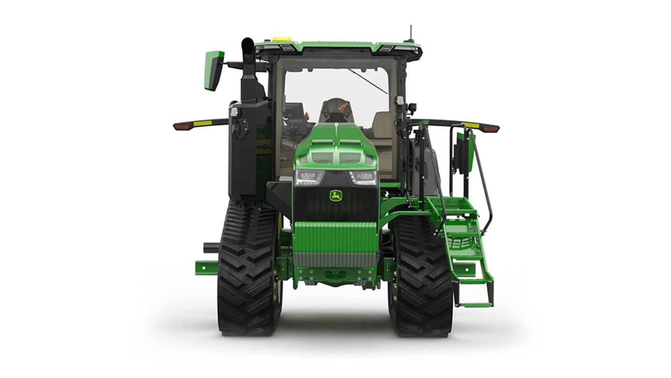 Front-facing studio shot of a 2-tracked green tractor on a white background.