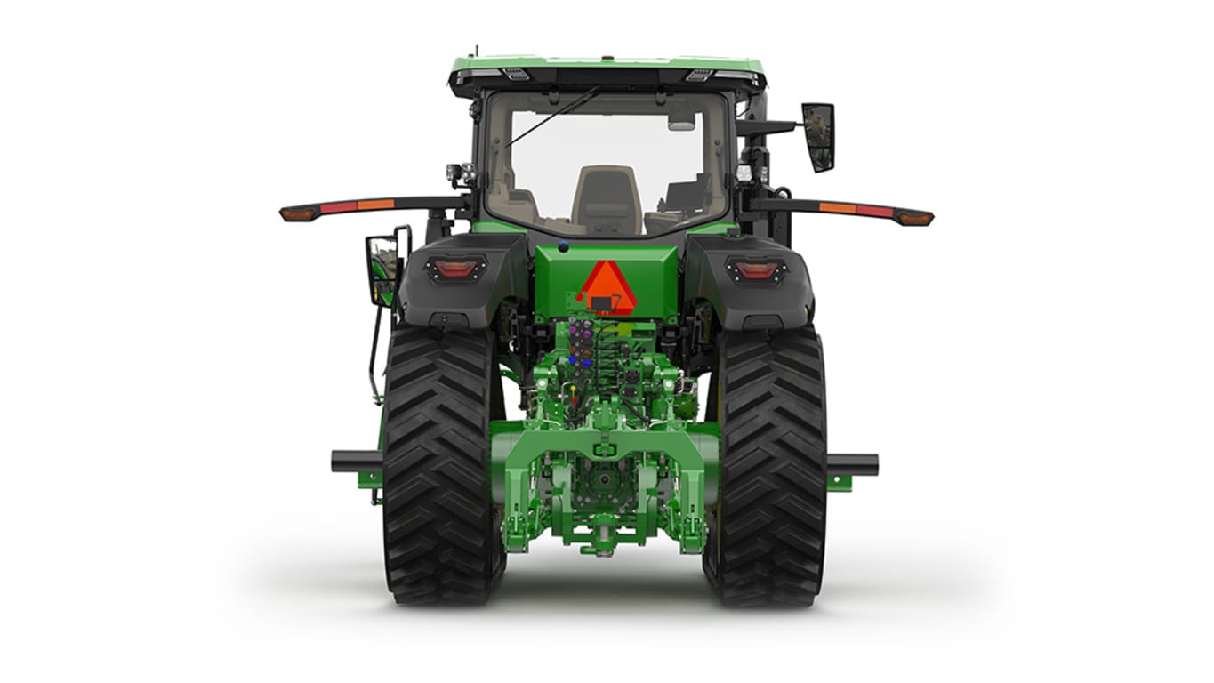 Rear-facing studio shot of a 2-tracked green tractor on a white background.