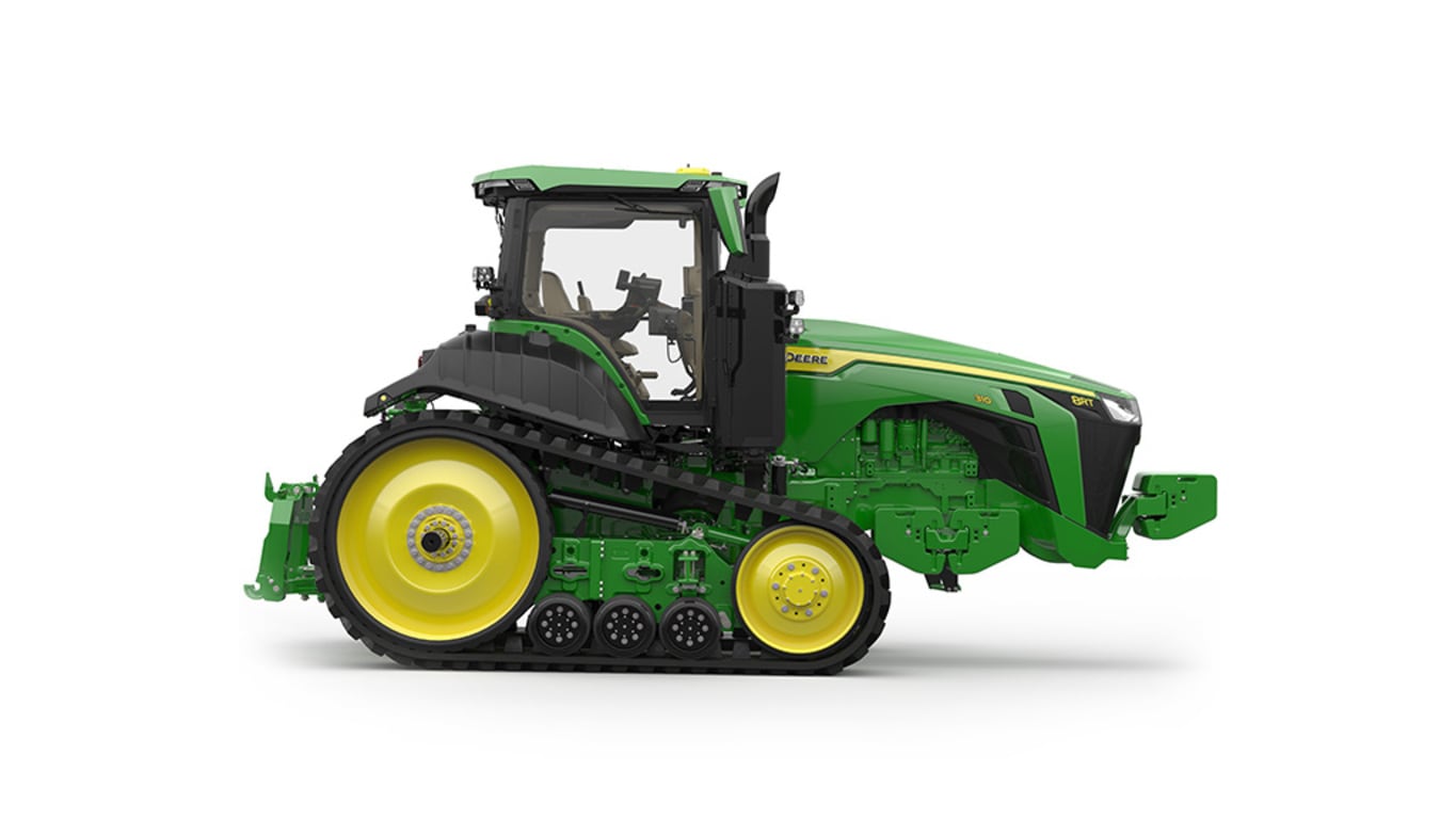 Right-facing studio shot of a 2-tracked green tractor on a white background.