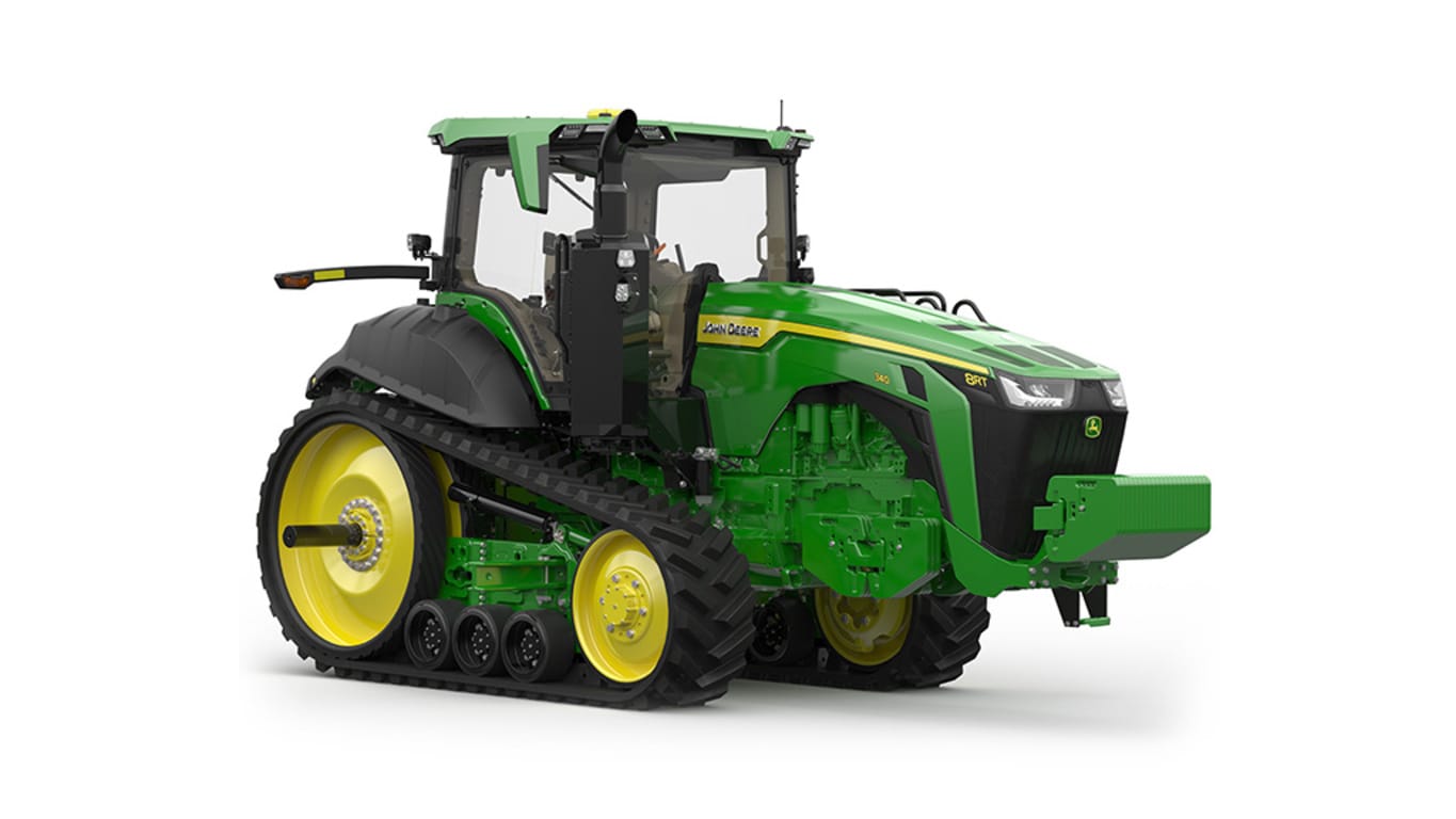 Image studio&nbsp;d'un tracteur vert&nbsp;à&nbsp;2&nbsp;chenilles vu de l'avant droit sur fond blanc.