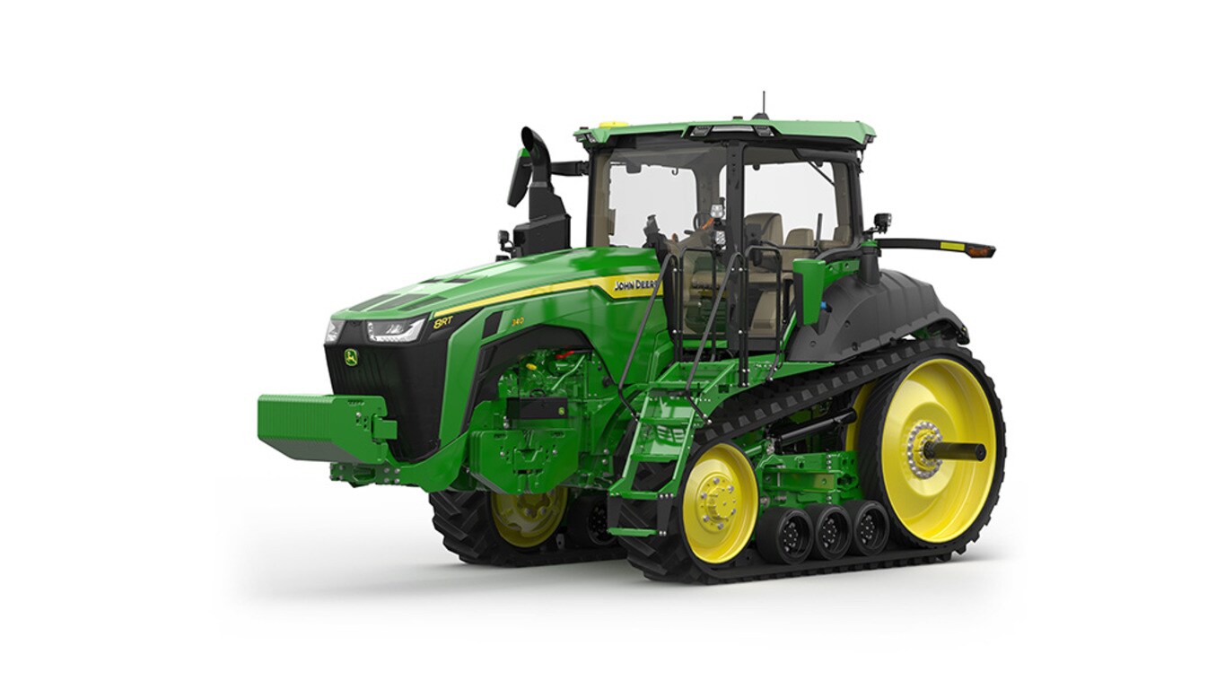 Image studio d'un tracteur vert à&nbsp;2&nbsp;chenilles vu de l'avant gauche sur fond blanc.