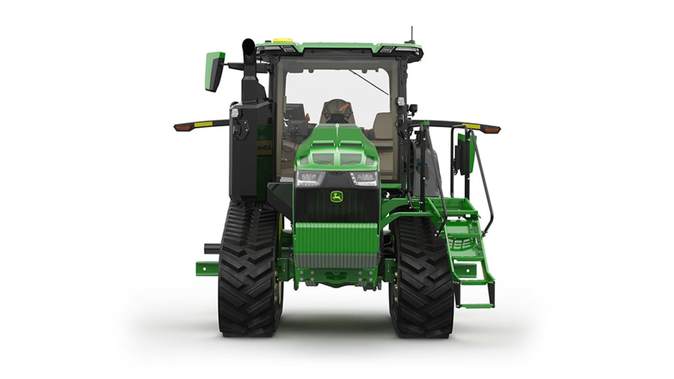 Image studio d'un tracteur vert à&nbsp;2&nbsp;chenilles vu de l'avant sur fond blanc.