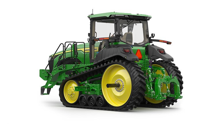 Image studio d'un tracteur vert à&nbsp;2&nbsp;chenilles vu de l'arrière gauche sur fond blanc.