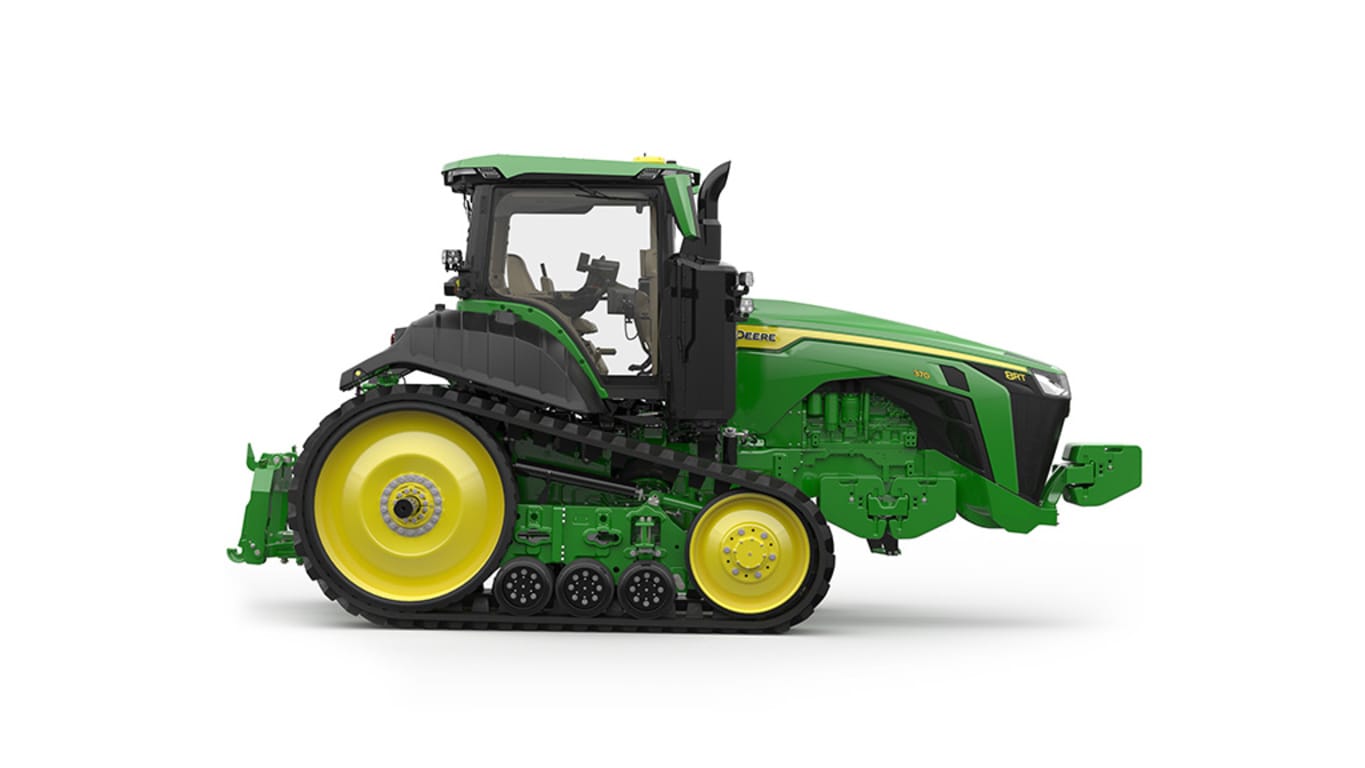 Image studio d'un tracteur vert à&nbsp;2&nbsp;chenilles vu de la droite sur fond blanc.
