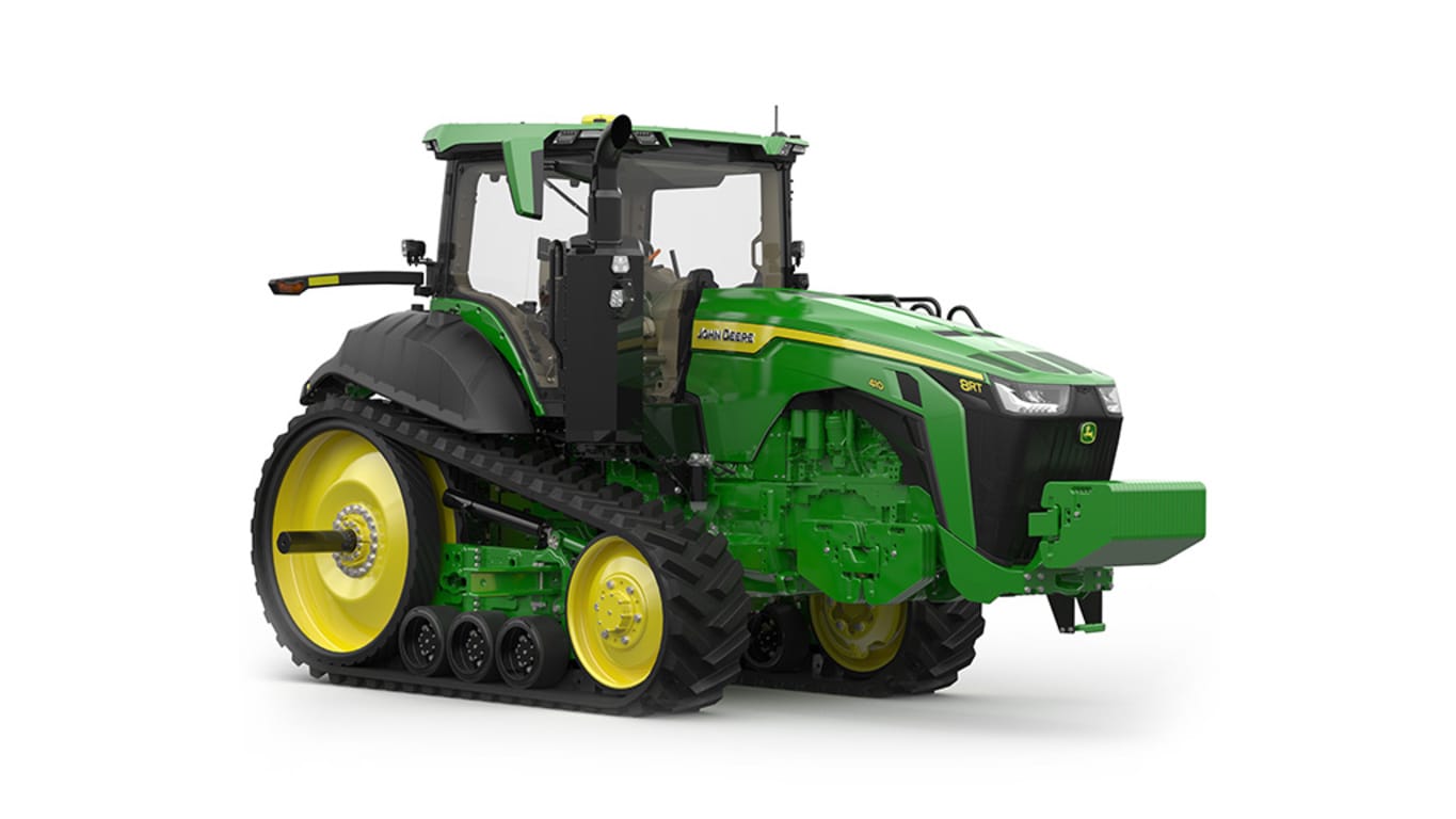 Image studio&nbsp;d'un tracteur vert&nbsp;à&nbsp;2&nbsp;chenilles vu de l'avant droit sur fond blanc.