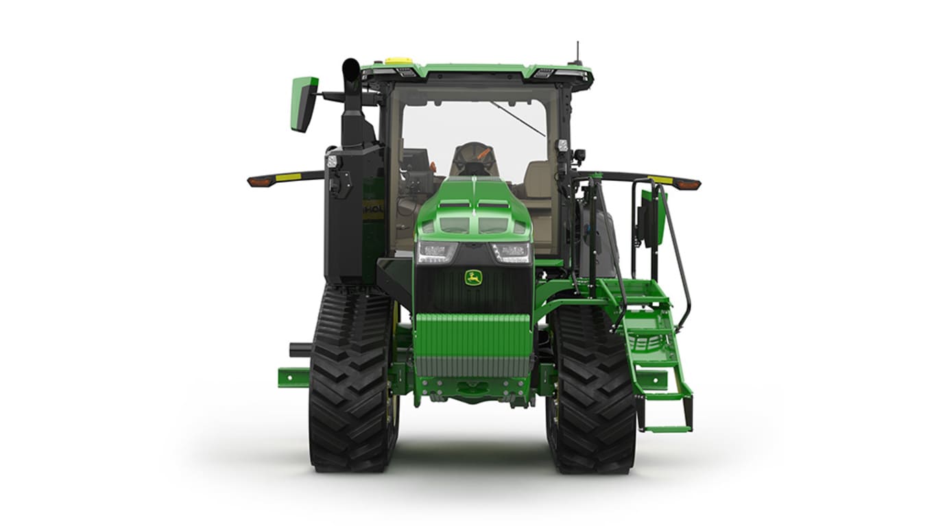 Front-facing studio shot of a 2-tracked green tractor on a white background.