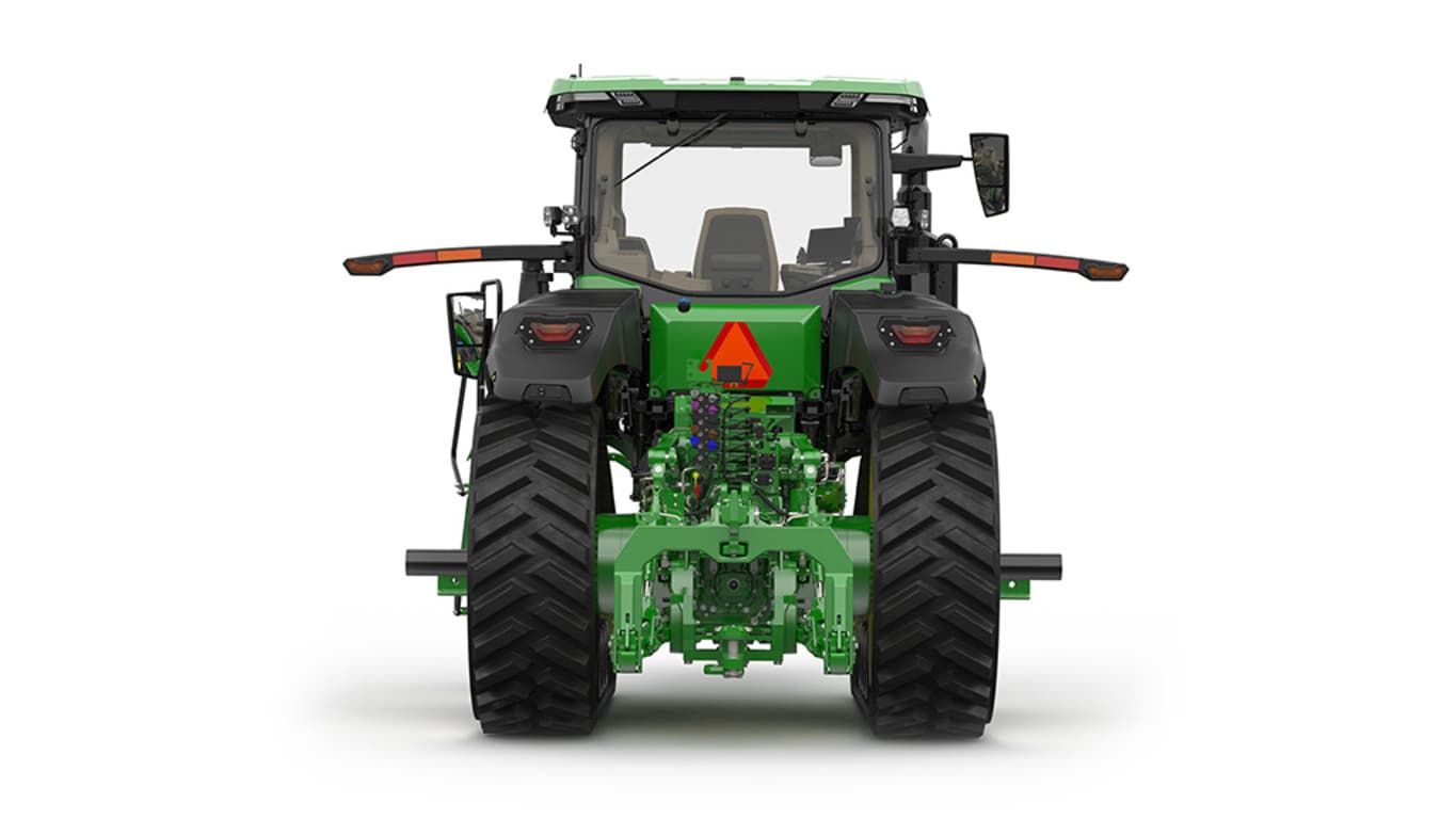Rear-facing studio shot of a 2-tracked green tractor on a white background.