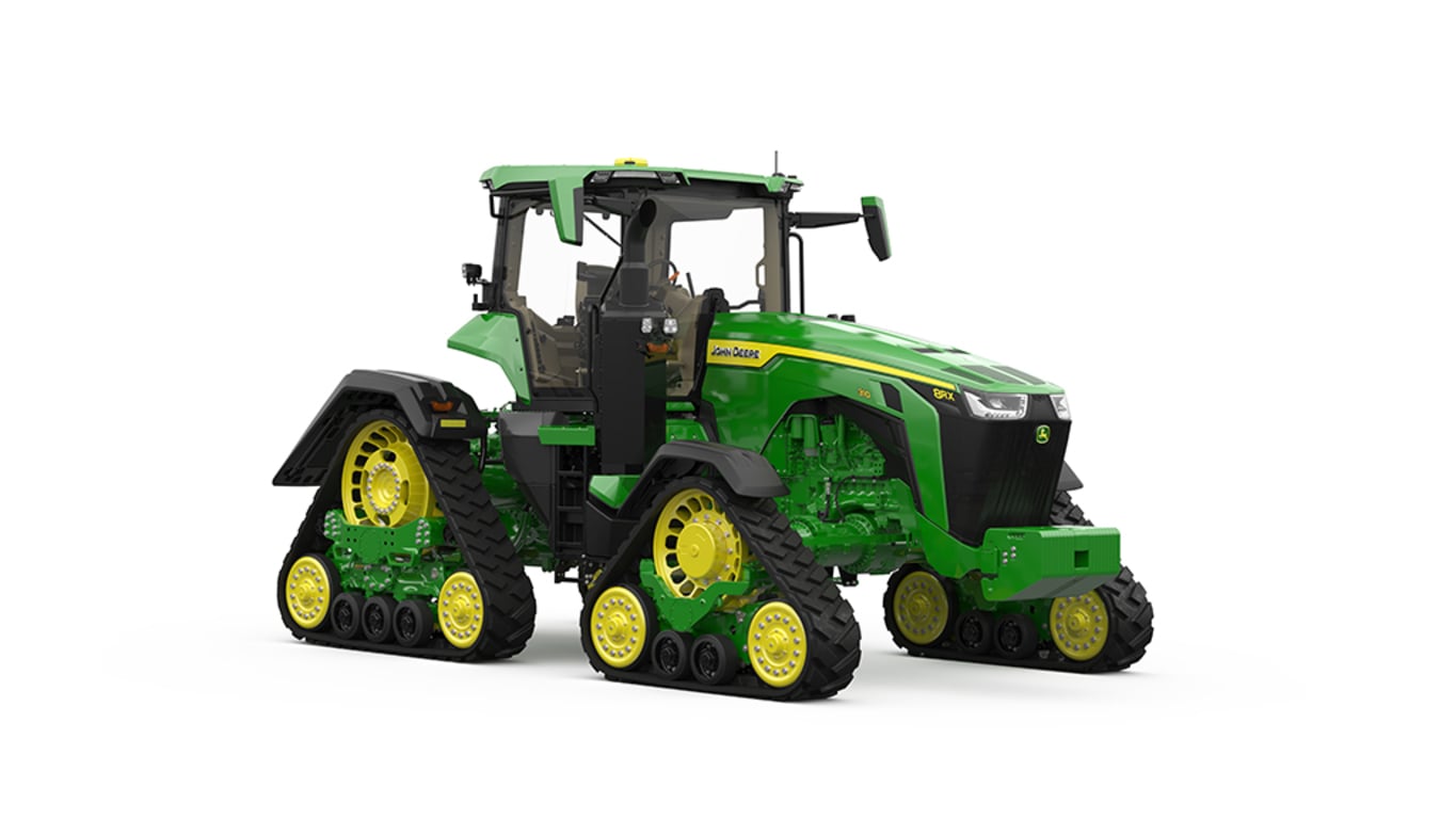 Front-right-facing studio shot of a 4-tracked green tractor on a white background.