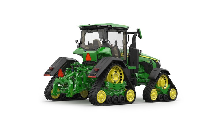 Image studio d'un tracteur vert à&nbsp;4&nbsp;chenilles vu de l'arrière droit sur fond blanc.
