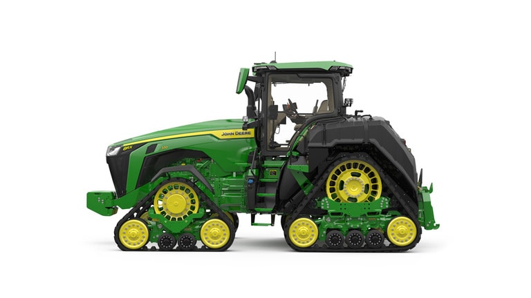 Image studio d'un tracteur vert à&nbsp;4&nbsp;chenilles vu de la gauche sur fond blanc.