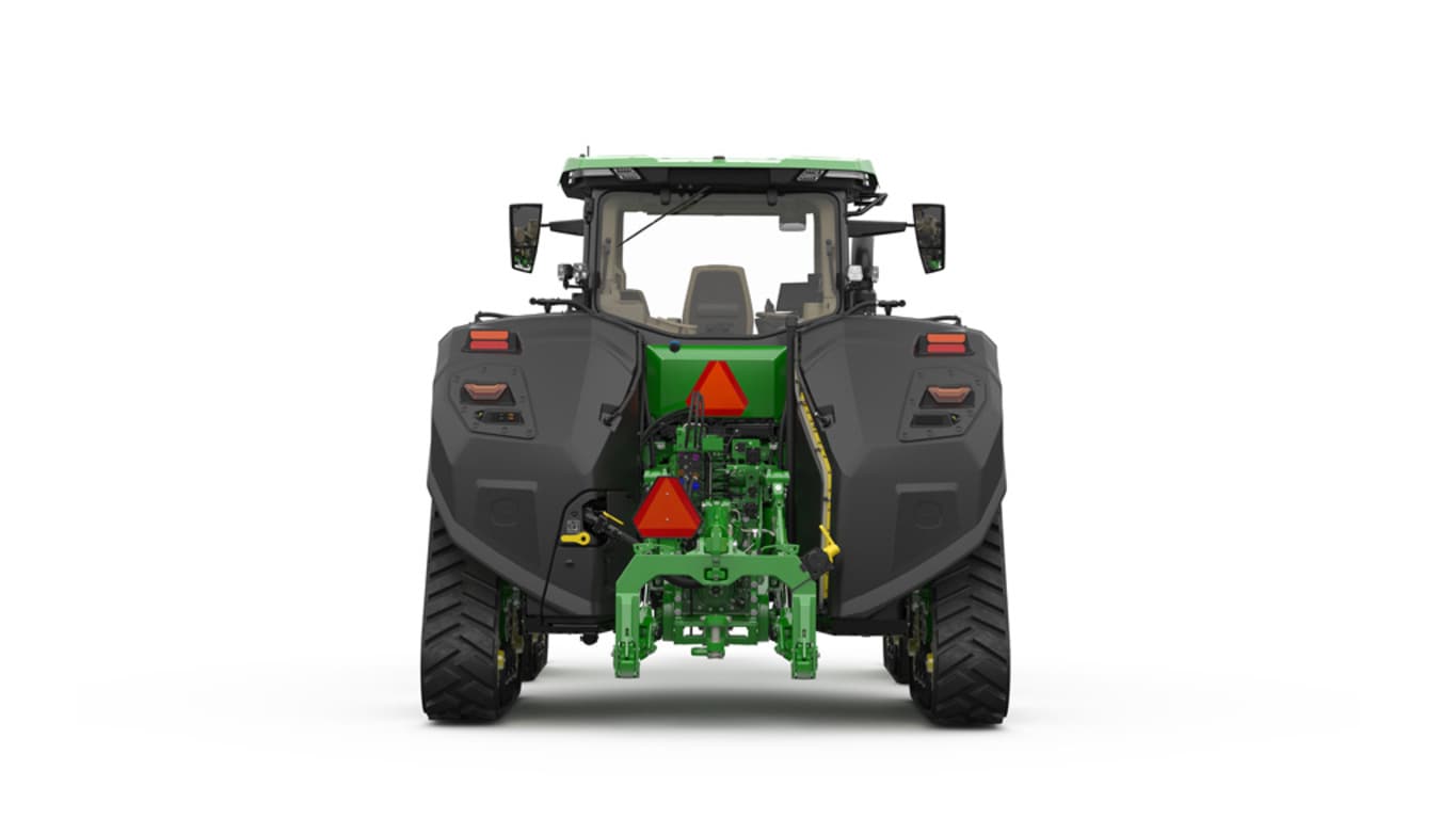 Image studio d'un tracteur vert à&nbsp;4&nbsp;chenilles vu de l'arrière sur fond blanc.