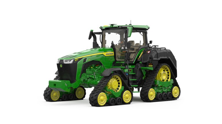 Front-left-facing studio shot of a 4-tracked green tractor on a white background.