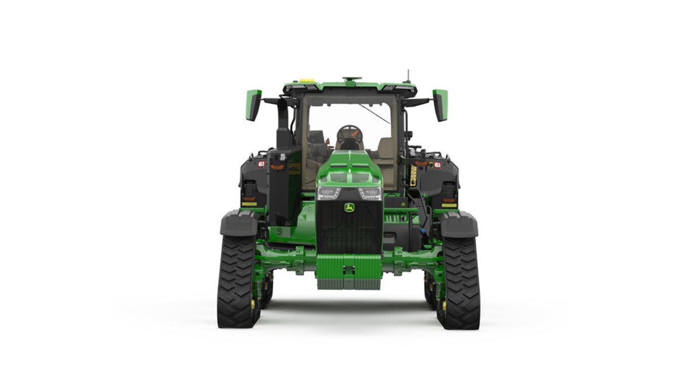 Front-facing studio shot of a 4-tracked green tractor on a white background.