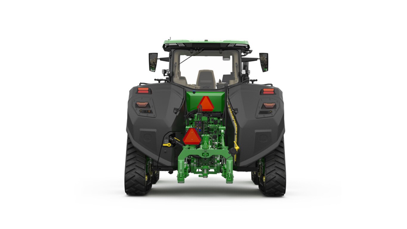 Rear-facing studio shot of a 4-tracked green tractor on a white background.